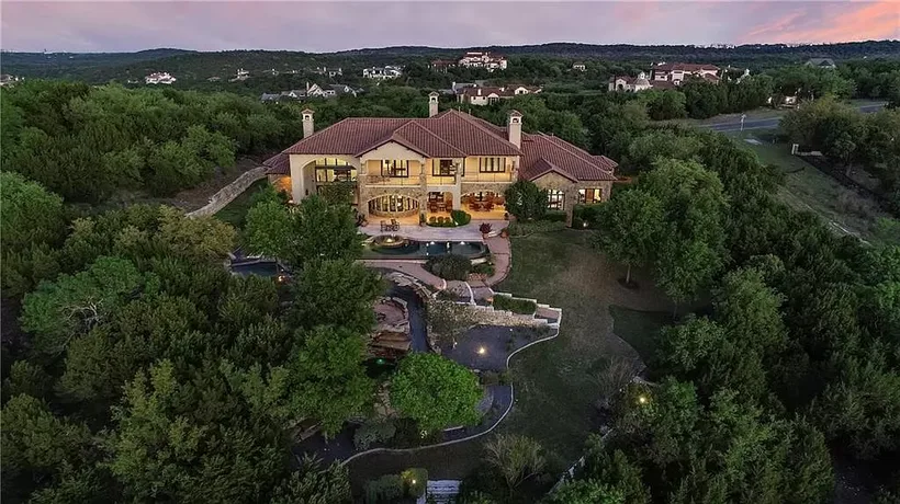 Aerial view of a Hill Country luxury home at dusk — listing photography example