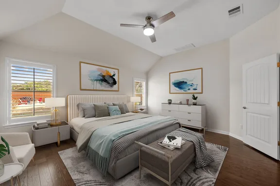Bedroom after staging — bed, bench, art