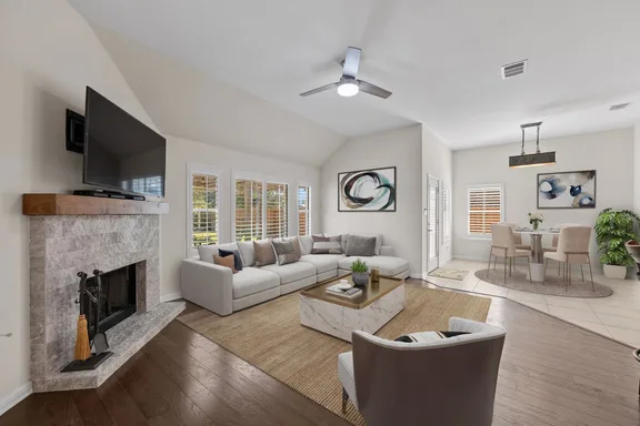 Living room after staging — sectional, coffee table, art