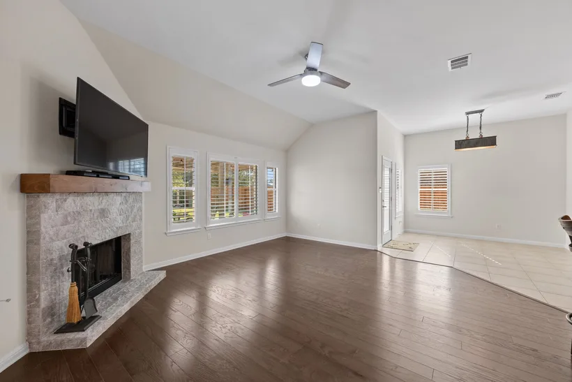 Living room before staging — empty room with fireplace